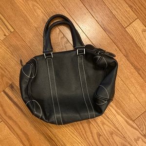 Barney’s black clutch